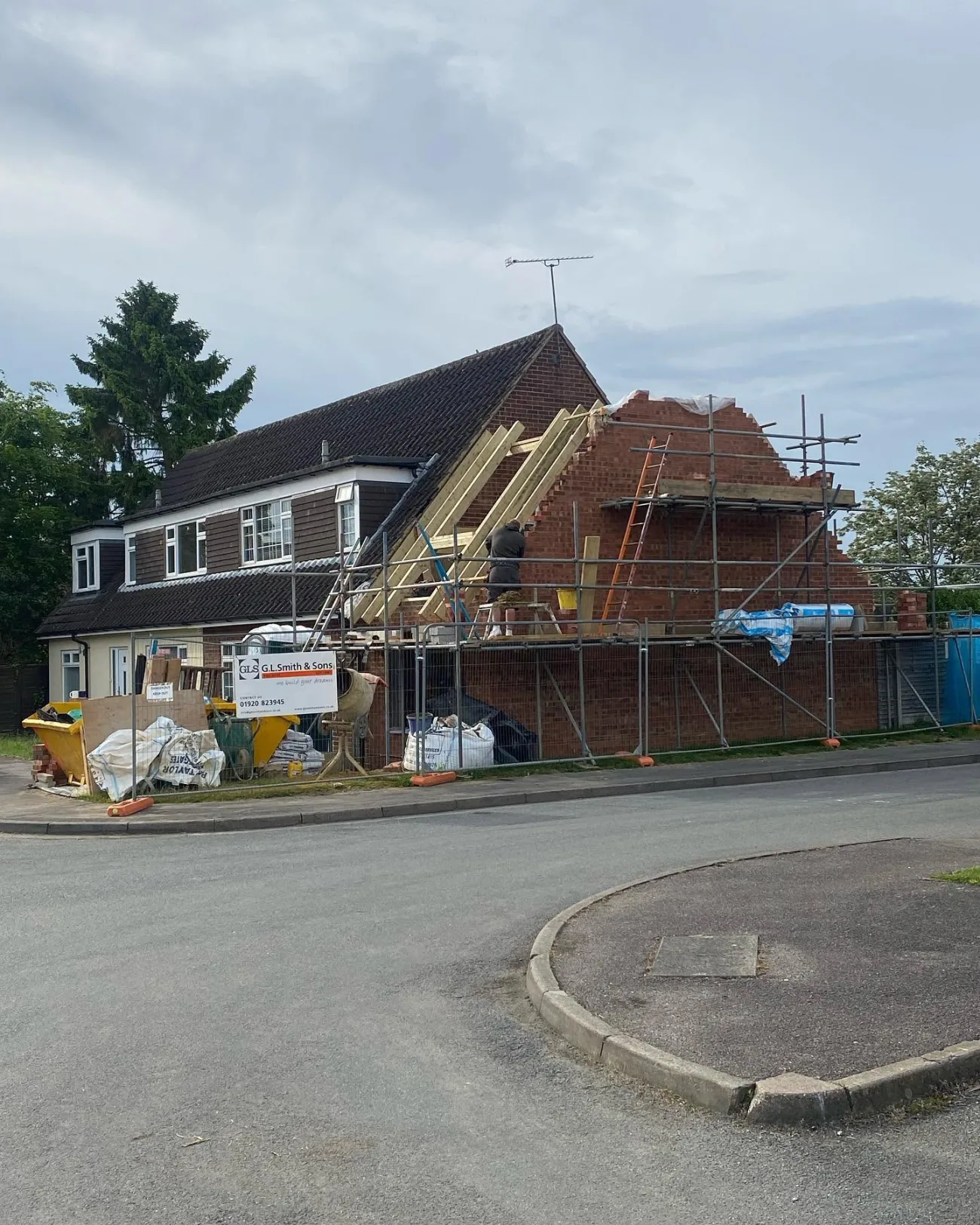 A gable rebuilt and re-roofed, with the G.L. Smith & Sons board on site