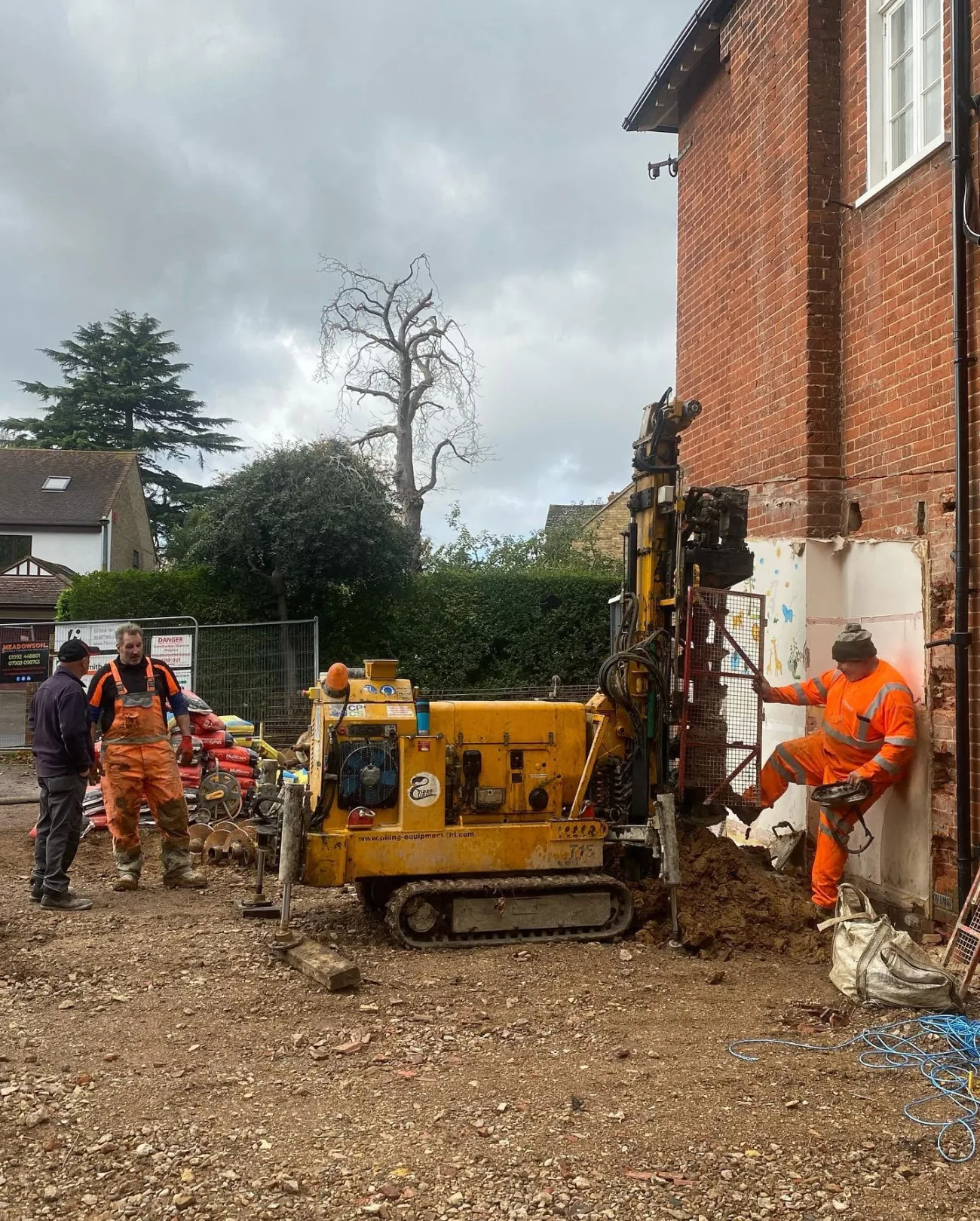 The groundworks crew at work beside an existing home