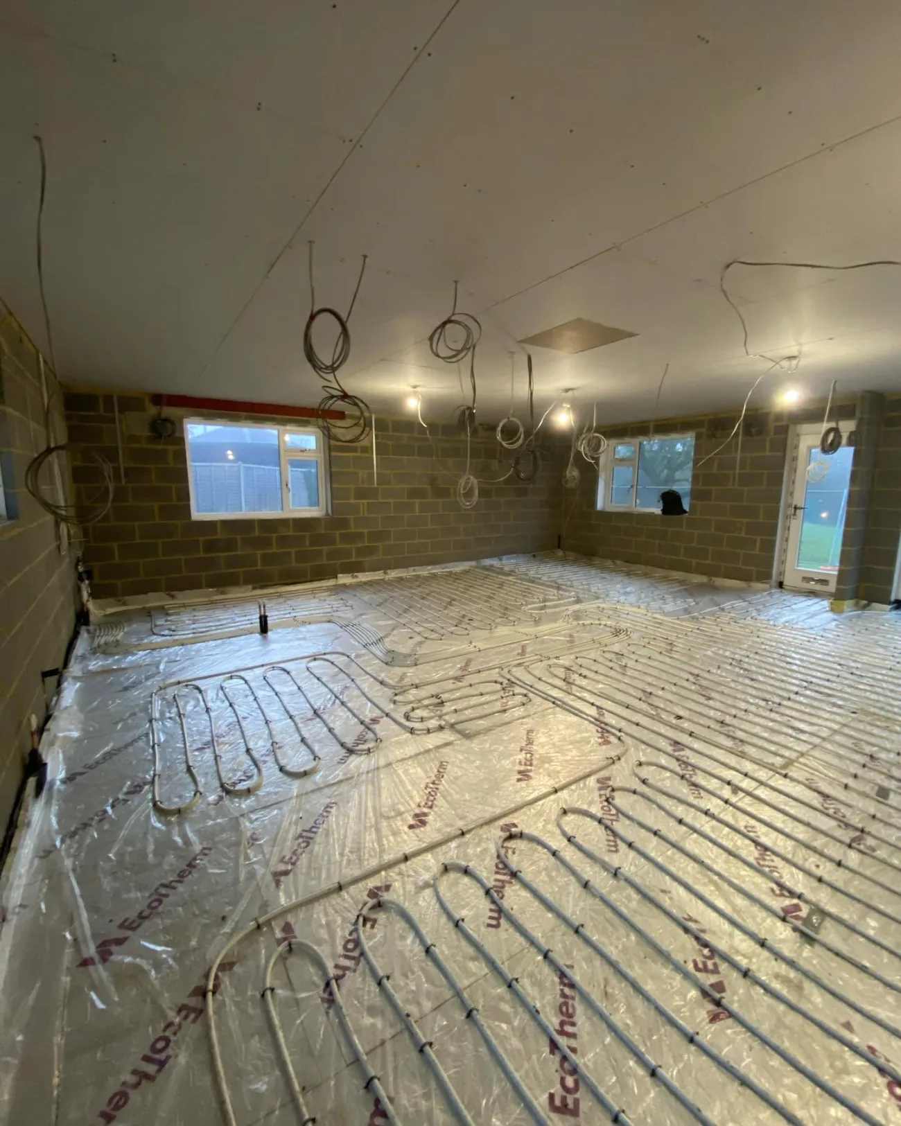 Underfloor-heating pipes laid out during first fix