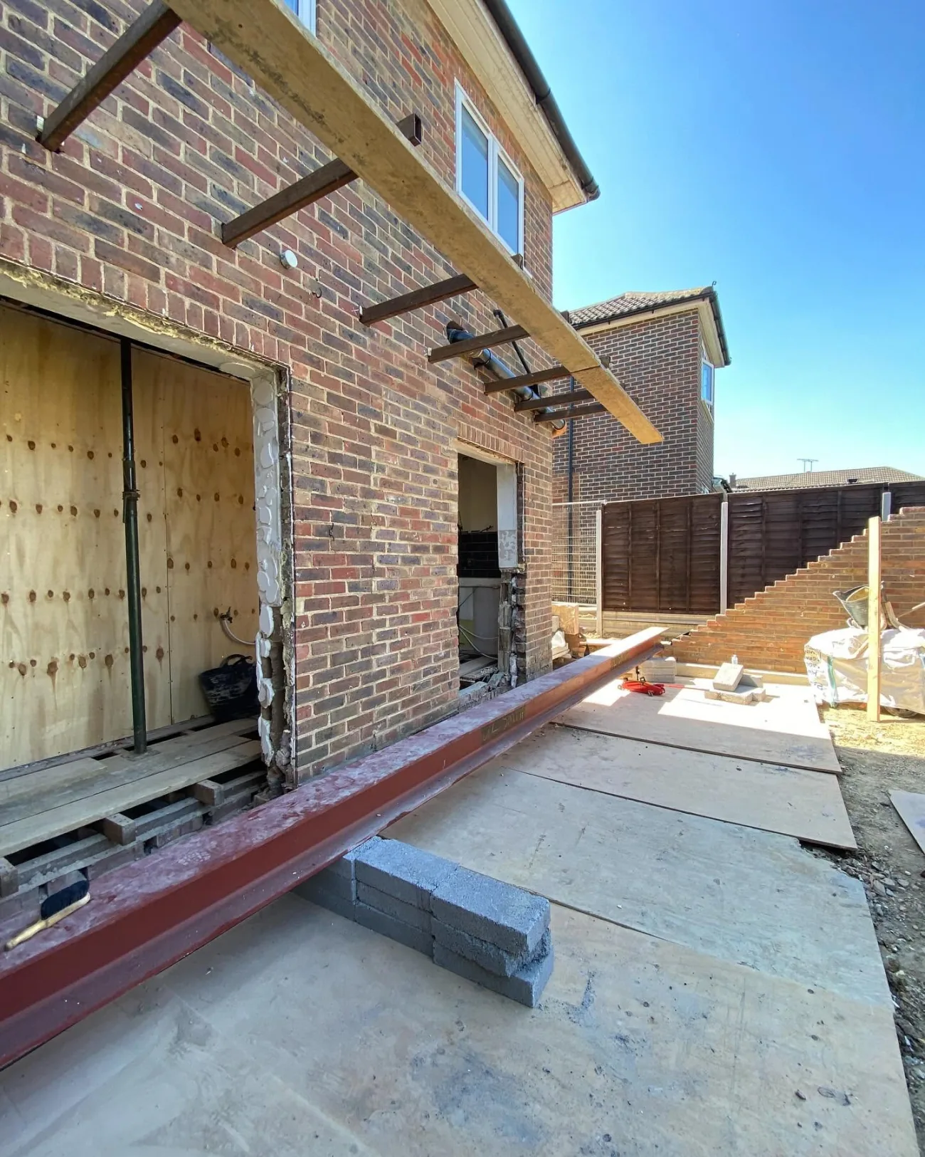 A structural steel beam set in to open up the back of a house for an extension