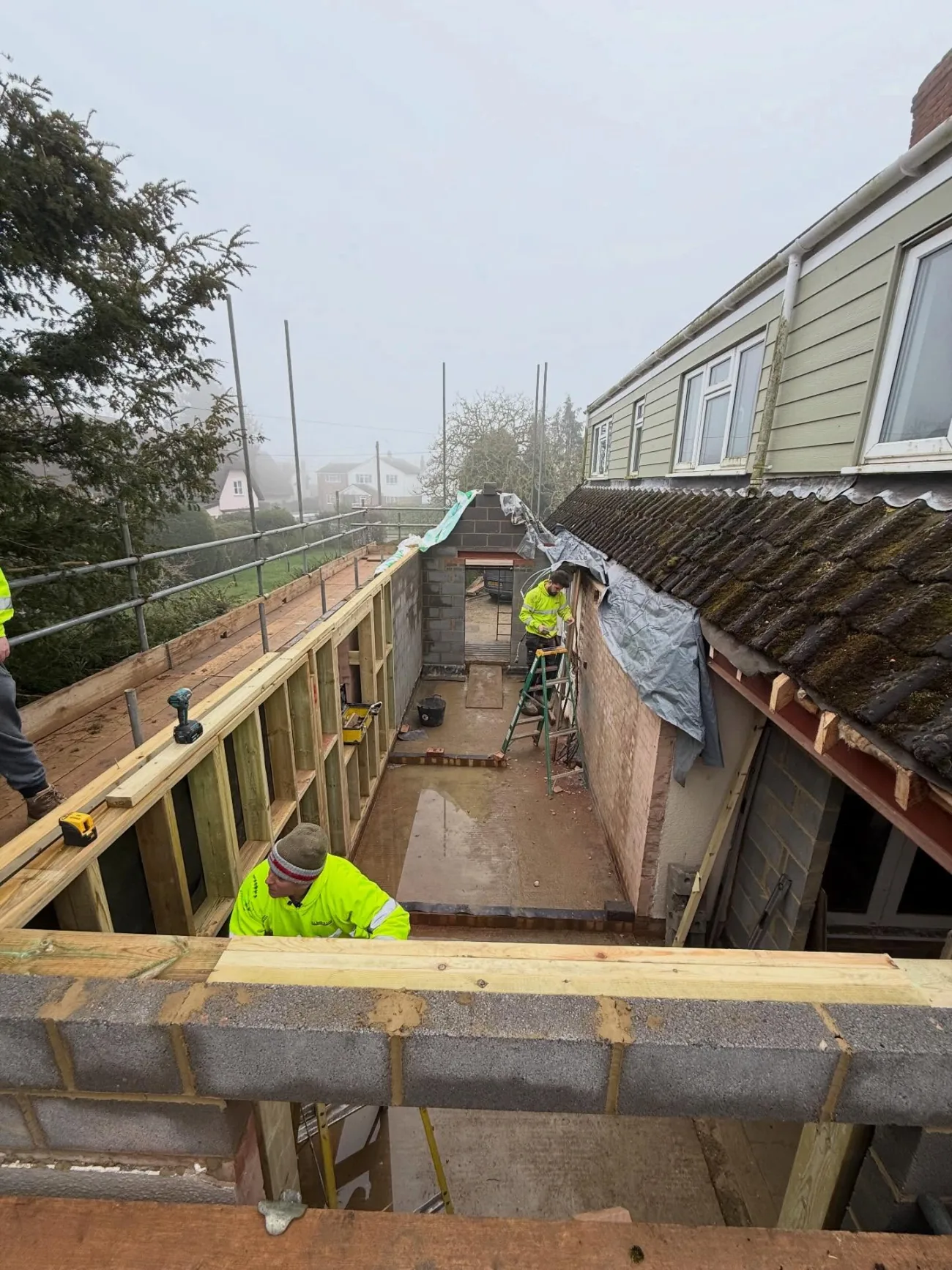 A rear extension taking shape in blockwork, ready for its roof