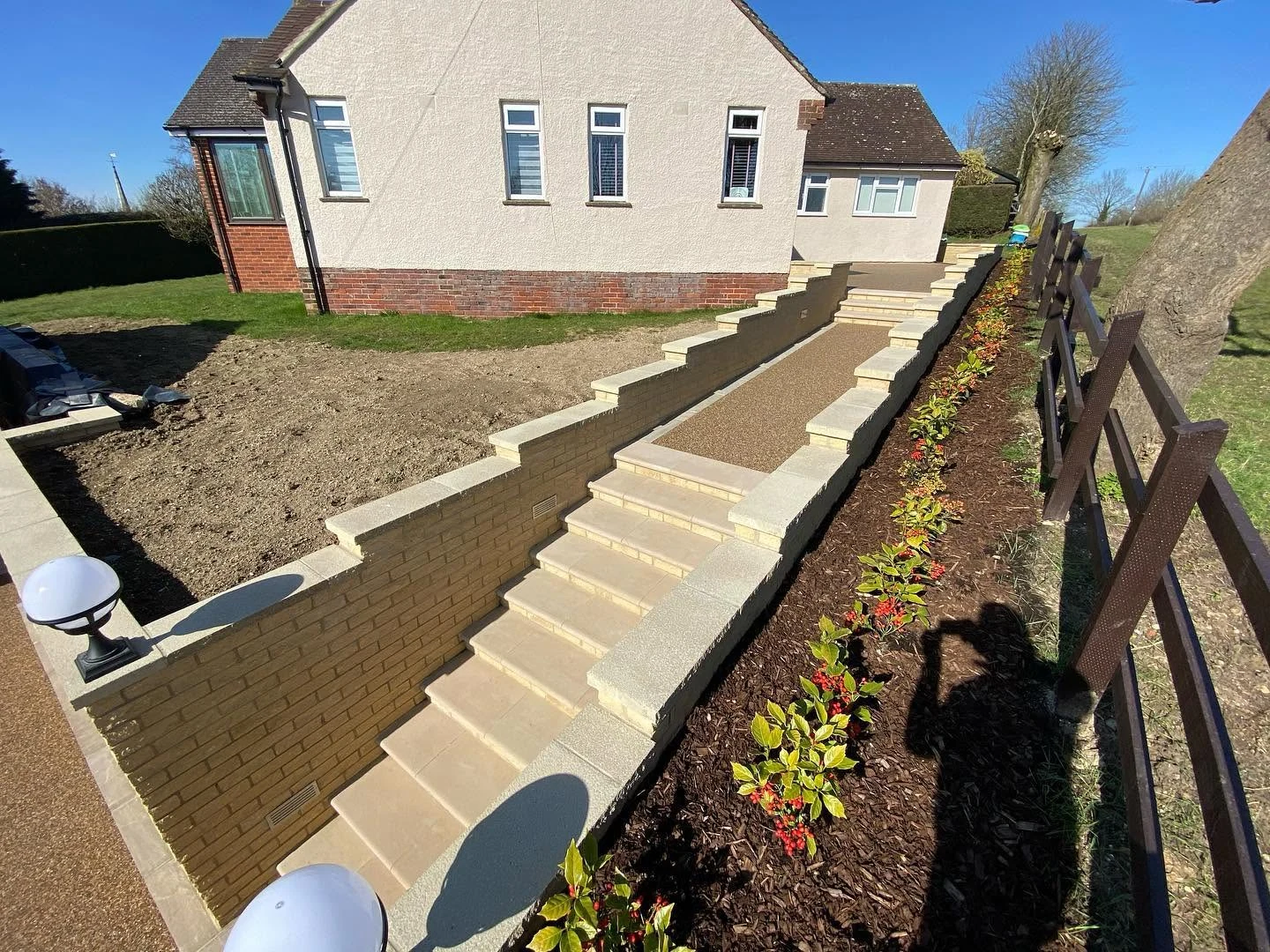 New sandstone steps and landscaping completing a home's approach