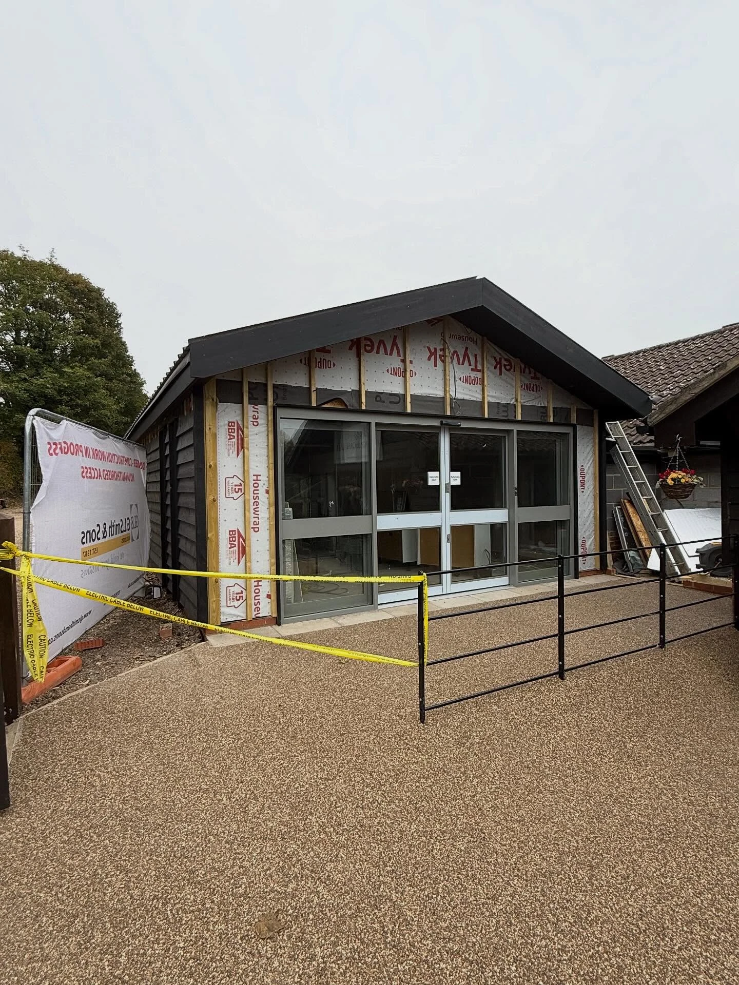 A contemporary clad building with a standing-seam roof